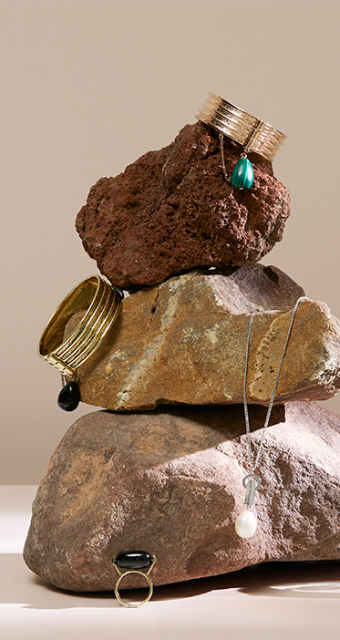 Jewellery designed in melbourne featuring layered metal, malachite and natural stones